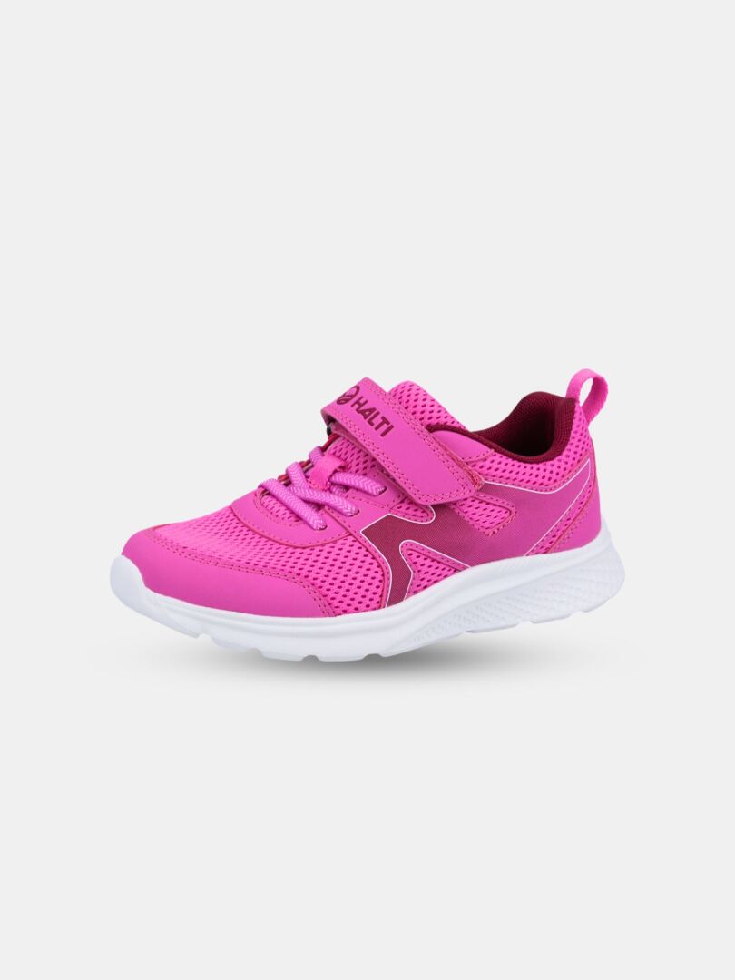 Halti Merry Sneaker Junior är en rosa barnsko med nätovandel, kardborreband och vit sula på enfärgad bakgrund.