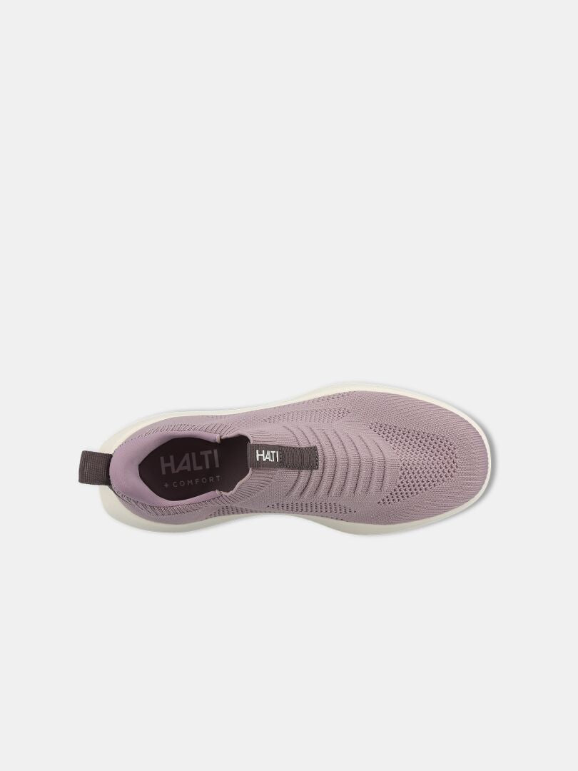 Ovanifrån syns en lila Halti Snabb 2 StepIn Sneaker Dam med vit sula och dragflik, märkt Halti Comfort.
