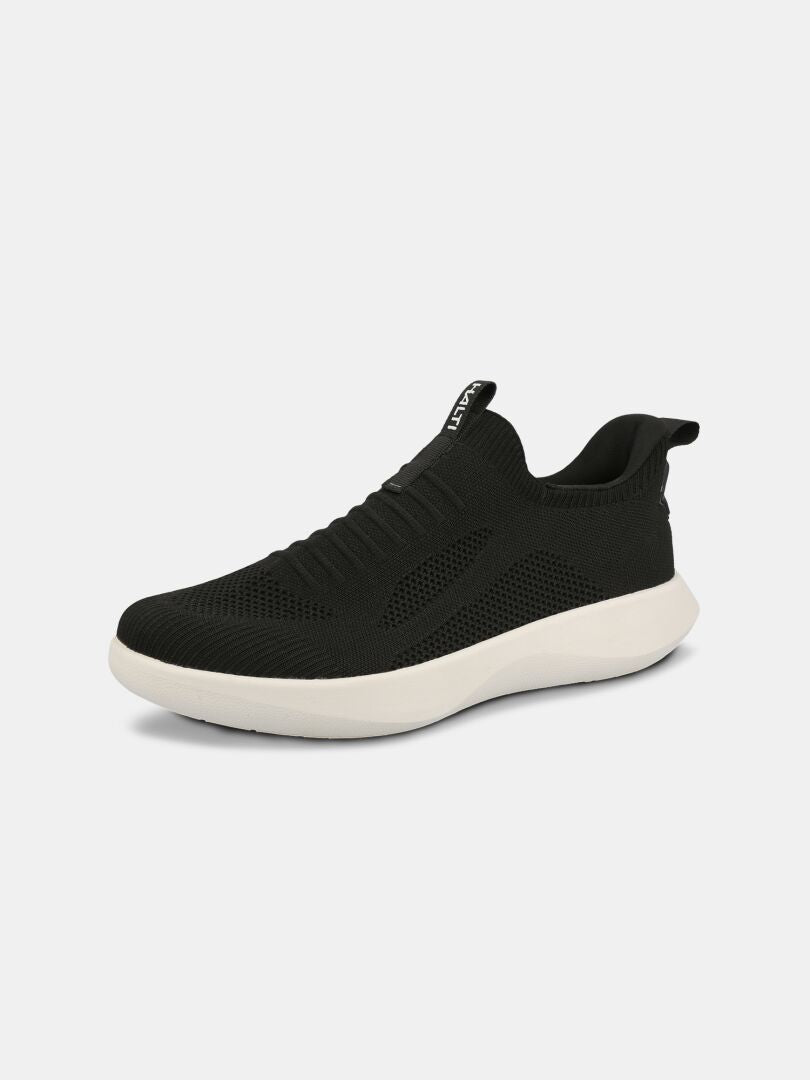 Halti Snabb 2 StepIn Sneaker Dam: svart slip-on med ovandel i mesh, dragflikar, vit sula och design som kan tvättas i maskin.