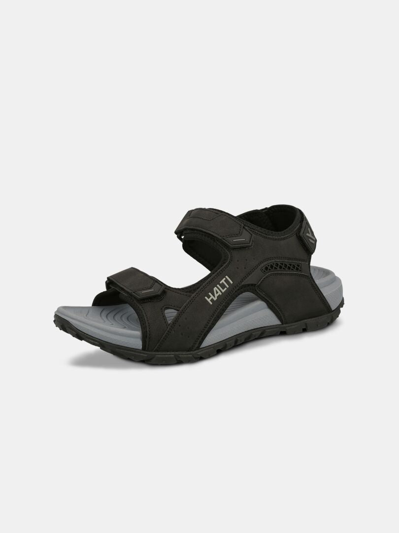 Halti Route 2 Sandal är svart och grå med justerbara remmar, ergonomisk fotbädd och HAITI på sidan.