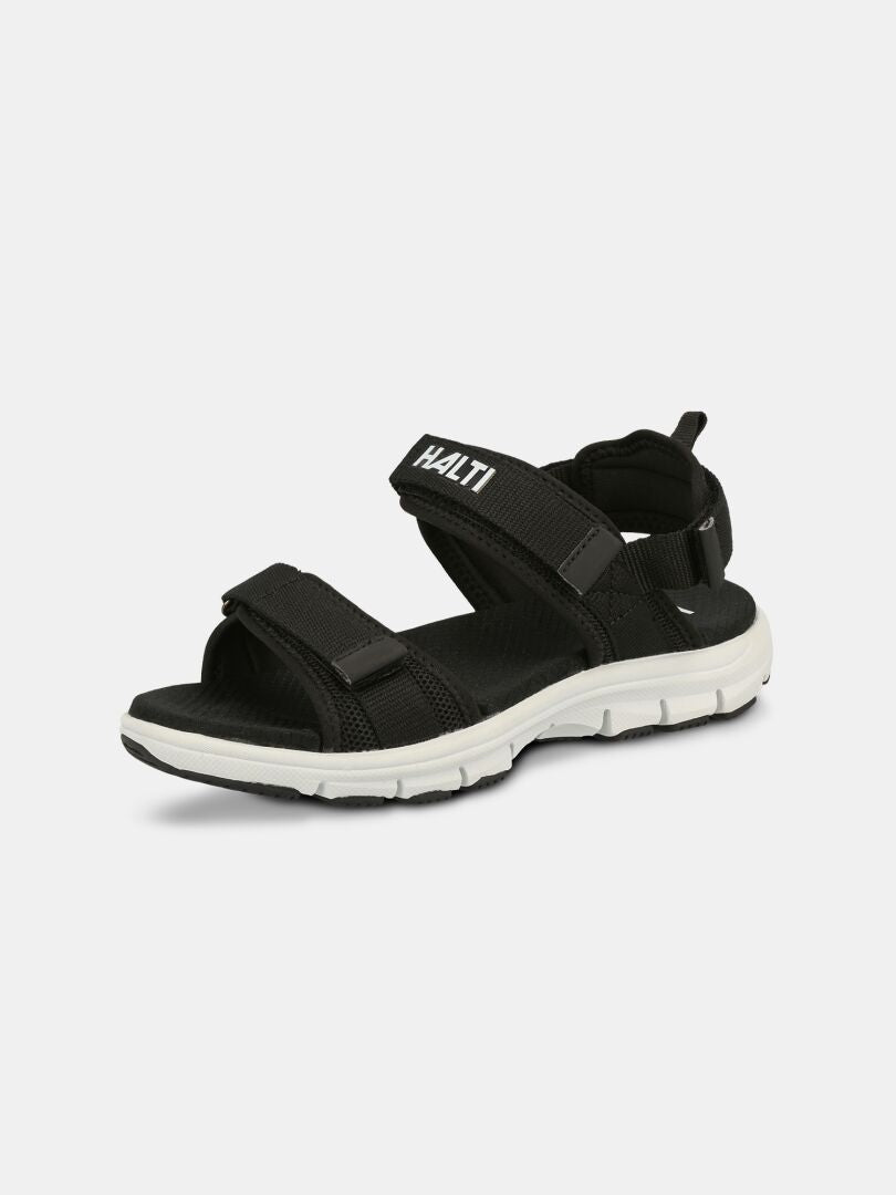 Den svarta Halti Resa 3 Sandal Dam för kvinnor med justerbara remmar och vit sula visas mot en vit bakgrund.
