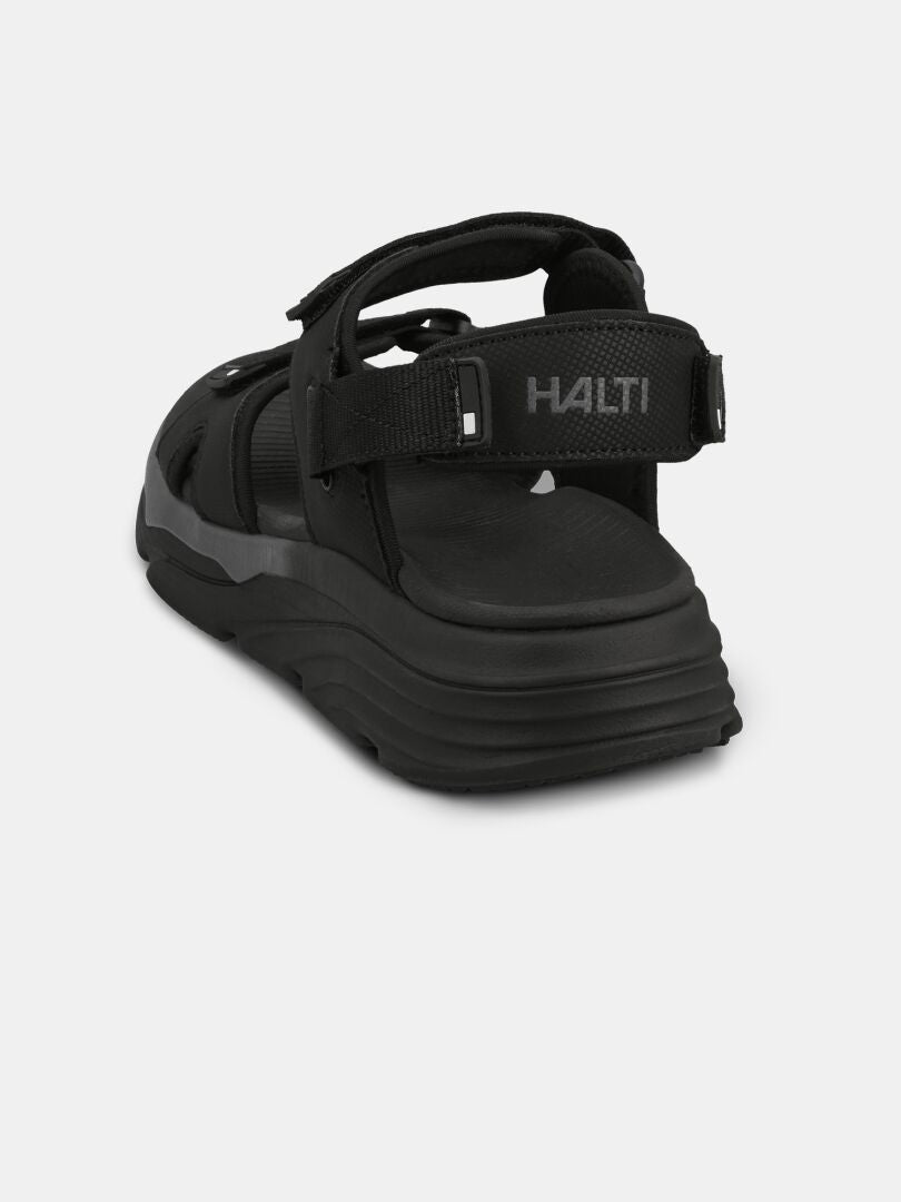Halti Pursuit 2 Sport Sandal är svart med kardborreband, Phylon-mellansula och HALTI-text på bakre remmen.