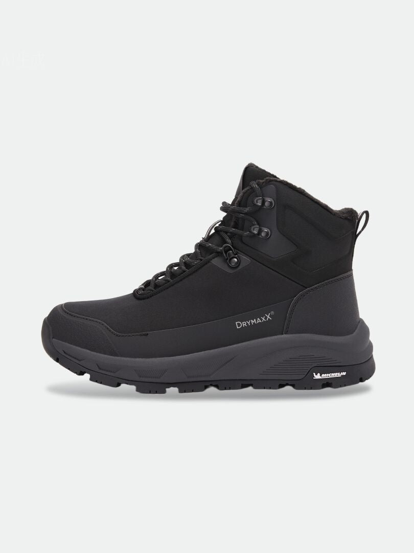 Svarta Tunturi Mid DX IC Vinterskor – unisex-vinterstövlar med snörning och en tjock sula med Michelin Ice Control-mönster.