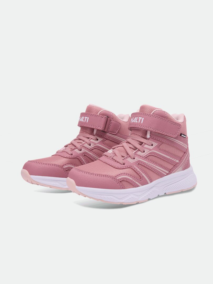 Halti Zuma Mid DX Sneaker Junior i rosa med vita sulor och HALTI-logotyp, avbildad mot en enfärgad ljus bakgrund.
