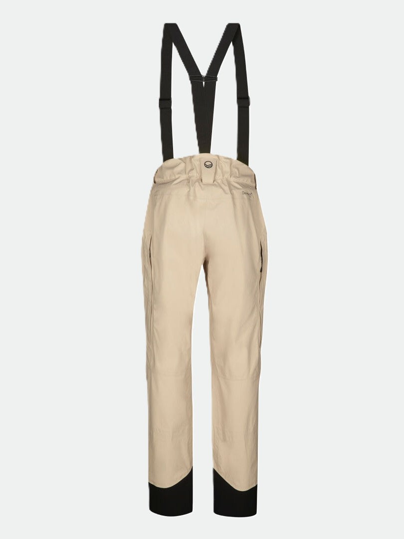 Halti Settler 3L DrymaxX skidbyxor Dam i beige med svarta hängslen och manschetter, på vit bakgrund.