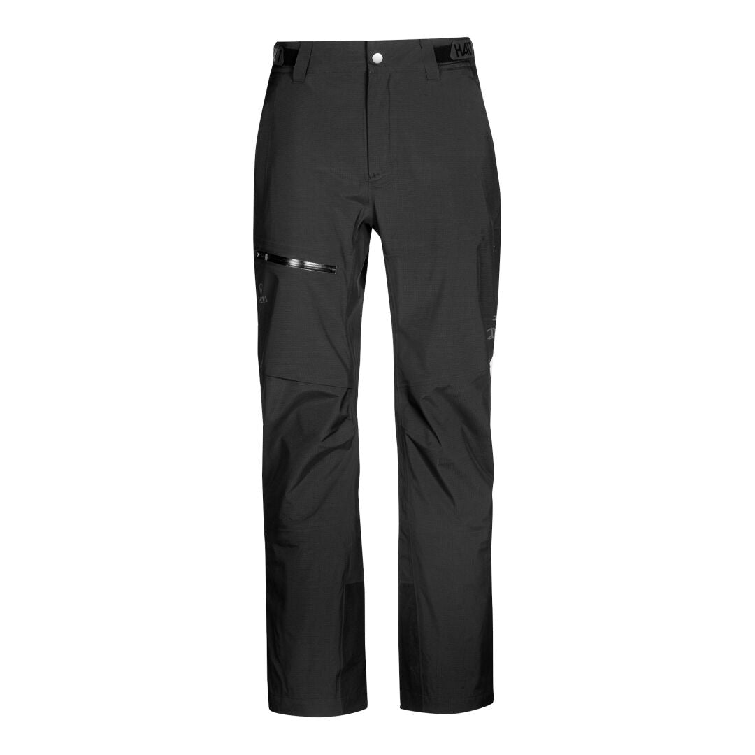 Halti Alpine 3L DrymaxX skalbyxor, svart, har dragkedja fram och snedställd ficka med dragkedja på höger lår.
