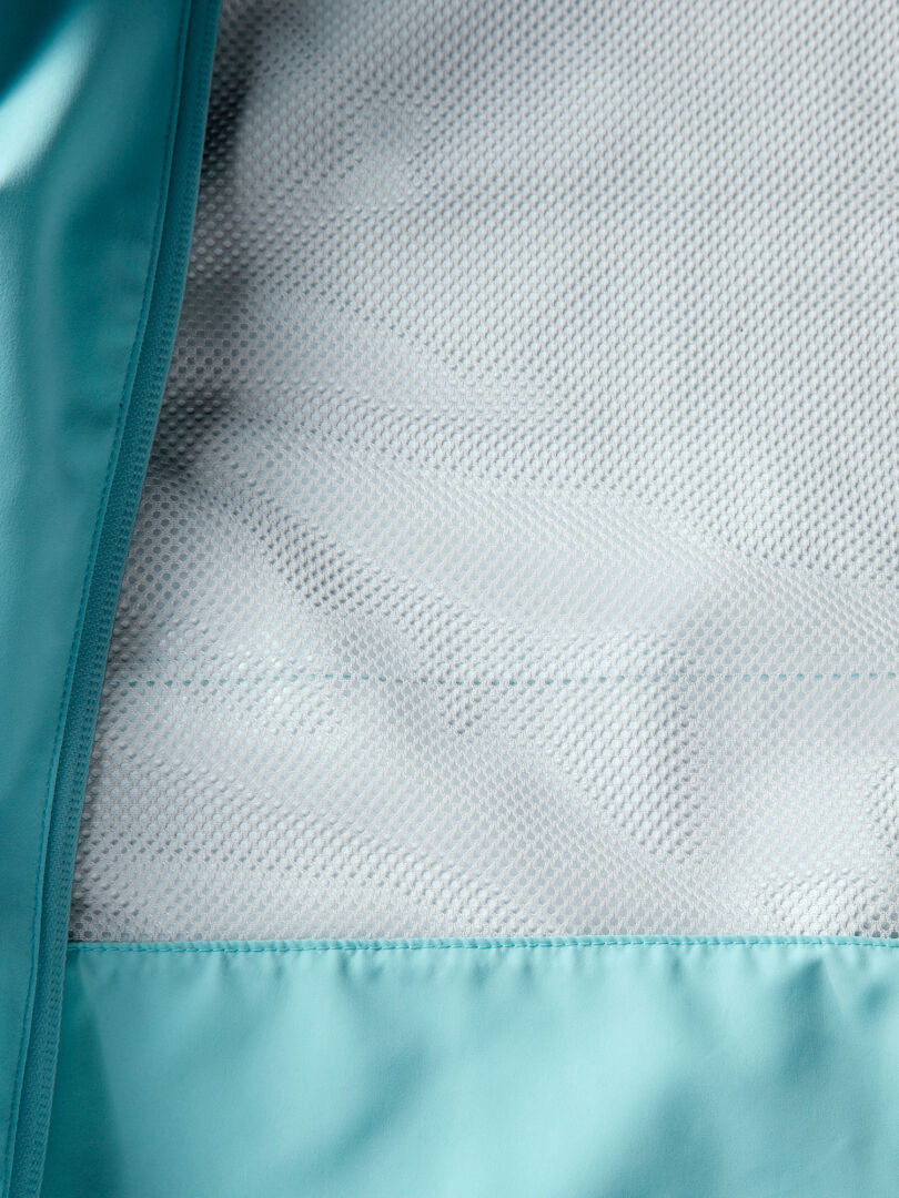 Närbild av Halti Staala DX Skaljacka Dam i turkos, med meshfoder och sömmar i detalj.