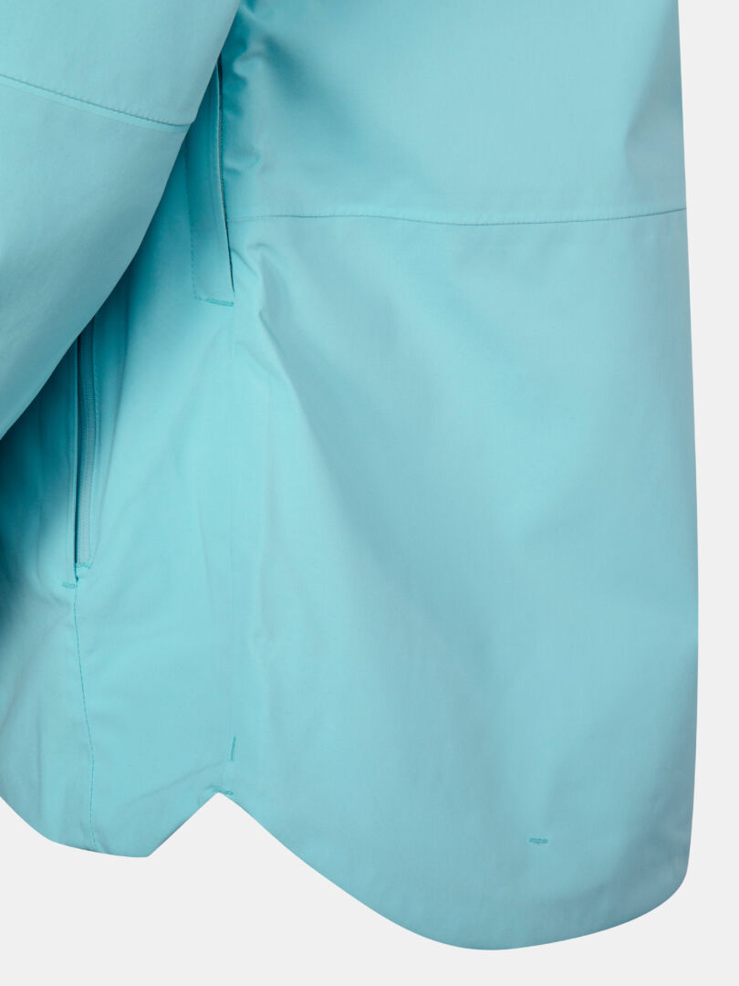 Närbild av Halti Staala DX Skaljacka Dams nedre halva, med en söm och en del av fickan med dragkedja markerade.