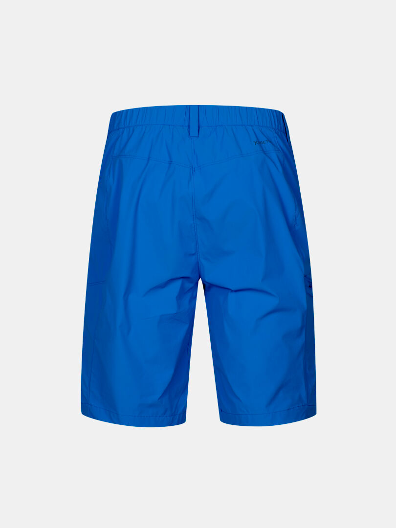 Baksida av Halti Pallas Cool X-stretch Shorts Herr, blå med resår i midjan och UPF 90+, mot vit bakgrund.