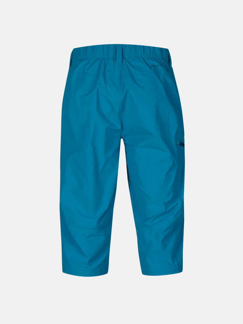 Halti Pallas Cool X-stretch Capribyxor Herr, blå med resår i midjan och sidoficka, visas mot vit bakgrund.