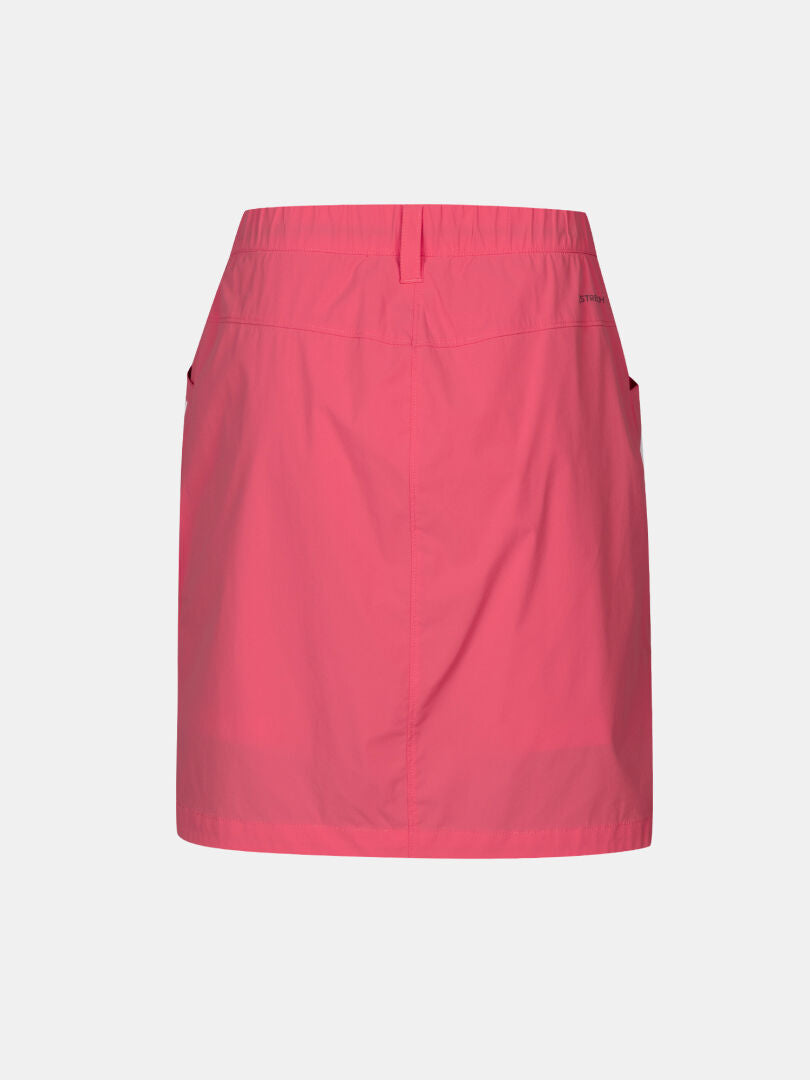 Halti Pallas Cool Skjol Dam är en rosa knälång kjol med elastisk midja, snabbtorkande tyg och två sidofickor.