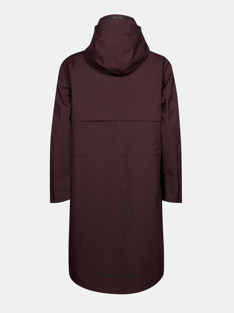 Halti Tokoi II DX Parkajacka Dam i mörkt rödbrun färg visas bakifrån mot en vit bakgrund.