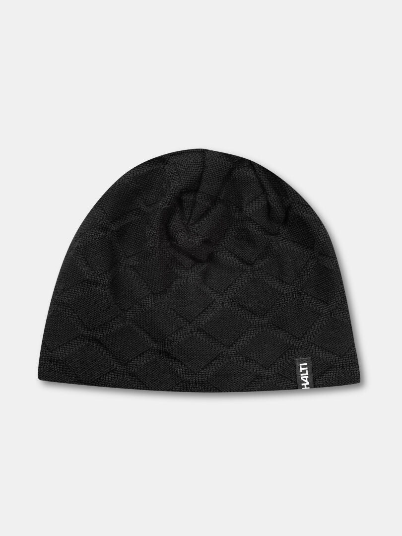 En svart Halti Crostie Merinomössa med quiltad design och logotagg, mot en enfärgad grå bakgrund.