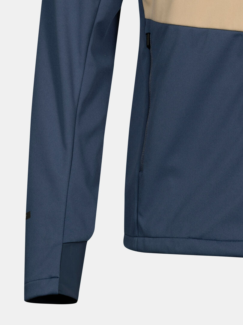 Närbild av Halti Framover Längdskidjacka Herr i blått och beige, med en sidoficka med dragkedja.