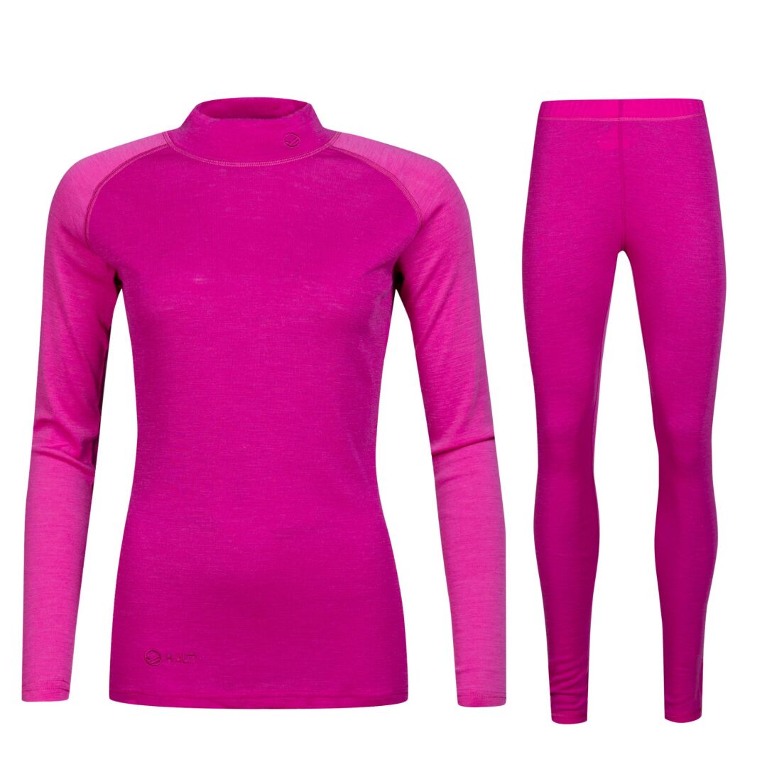 Halti Neva Merinoull Underställsset Dam i ljusrosa: långärmad topp och leggings på vit bakgrund.