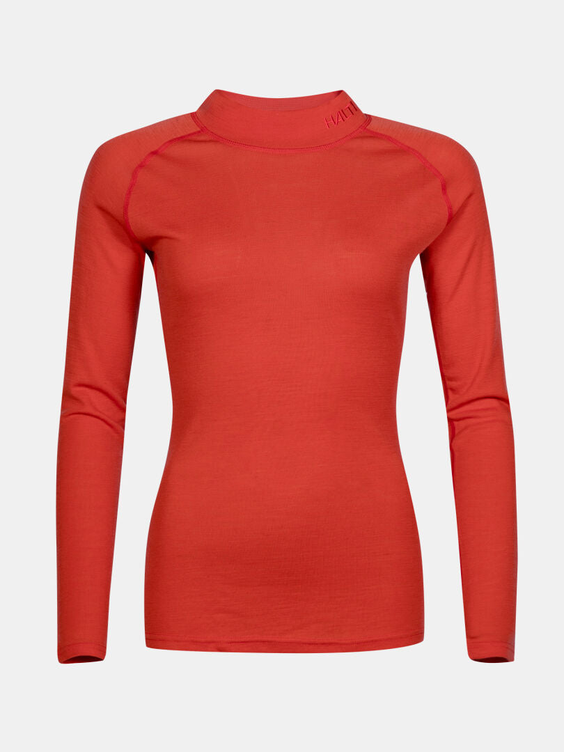 Halti Neva Merinoull Underställsset Dam: figurnära röd merino mix topp med mock hals, långa ärmar, enfärgad bakgrund.
