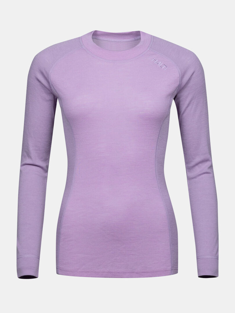 Halti Hossa II merino-undertröja för dam, långärmad, ljuslila med diskret logotyp på axeln, enfärgad bakgrund.