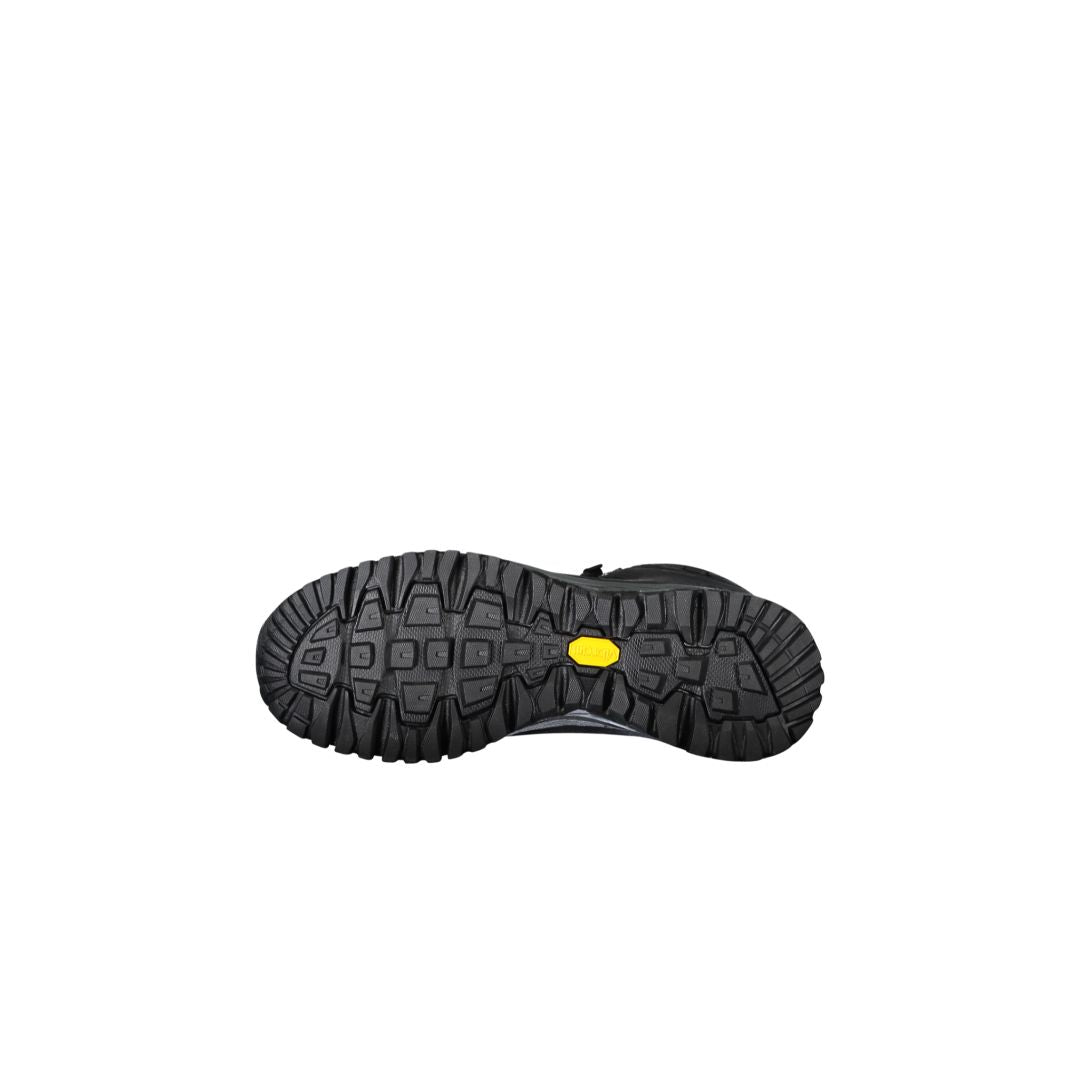 Halti Gompa DX Vandringskänga vandringssko med robust Vibram-sula och gula detaljer, visad mot vit bakgrund.