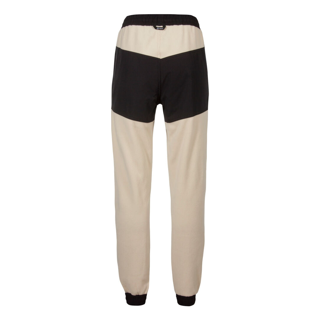 Halti Skugge Unisex Fleece Byxor: beige joggingbyxor med svart midjeband, ryggpanel och ärmslut – perfekt för en Skugge-look.