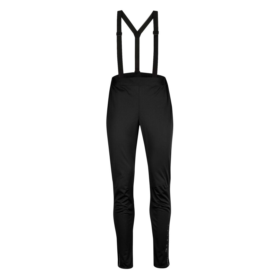Halti Olas Plus Dam Längdskidbyxor, svart med hängslen i återvunnen polyester, framifrån mot vit bakgrund.