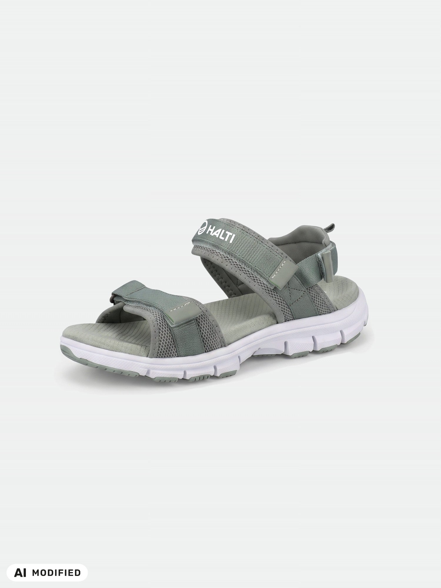 Halti Resa 2 Dam-sandal i grått med justerbara remmar och vit sula, avbildad mot en ljus bakgrund.