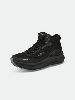 Halti Rapid DX Mid Outdoorskor Dam är en svart mid-top-sko med meshpaneler, tjock sula och Halti-märkning.