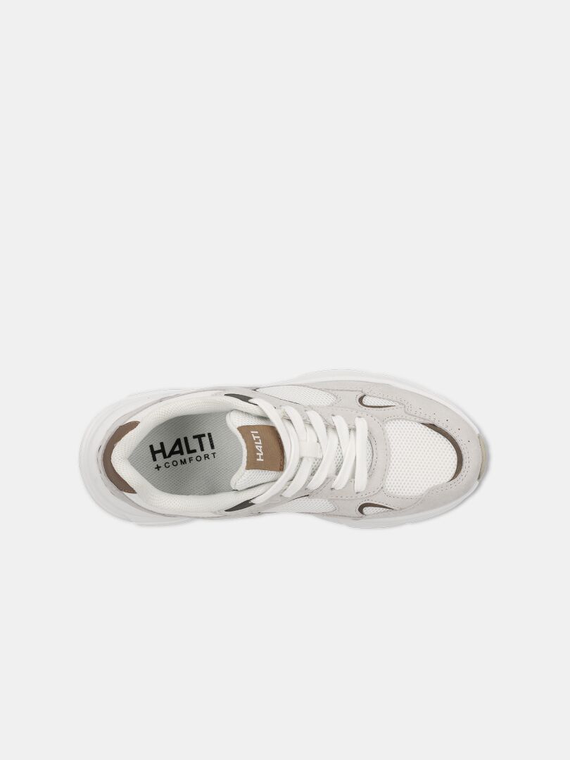 Uppifrån på Halti Tove Sneaker Dam i beige och vitt med vita snören och HALTI KOMFORT-märke på innersulan.