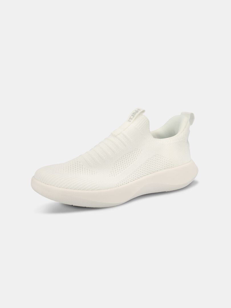 Halti Snabb 2 StepIn Sneaker Dam: en vit stickad ovandel, slip-on sneaker med tjock sula, visad i en liten vinkel.