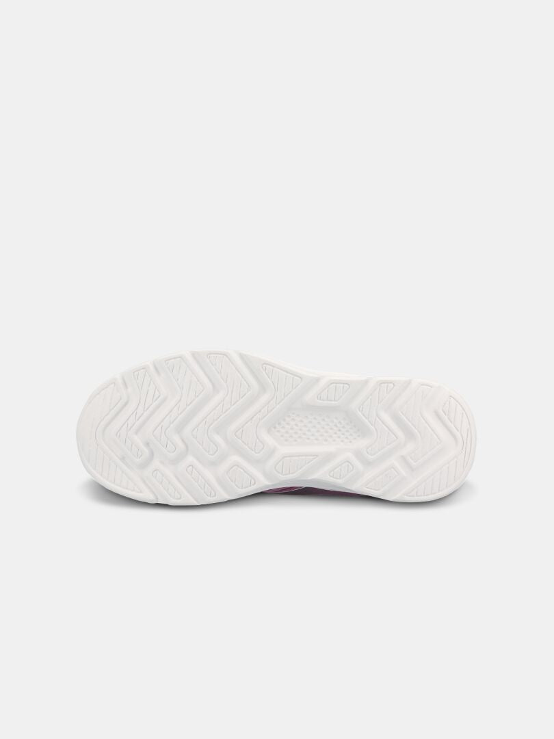 Halti Merry 2 Sneaker Junior har en vit sicksack-sula, perfekt som en lätt barnsneaker för sommaren, mot en ljusgrå bakgrund.