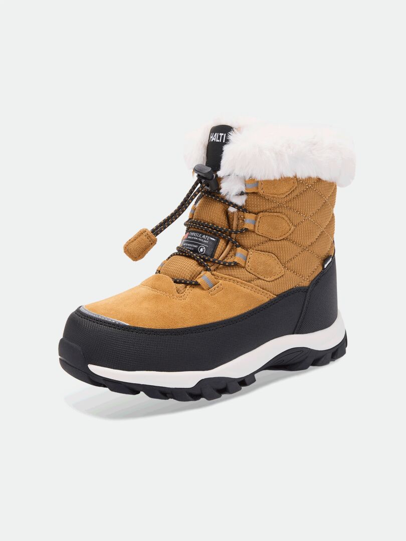 Halti Tornio DX vinterskor för juniorer: beige/svart, vitt fuskpäls, tjock sula, snörning framtill; avbildade mot ljus bakgrund.