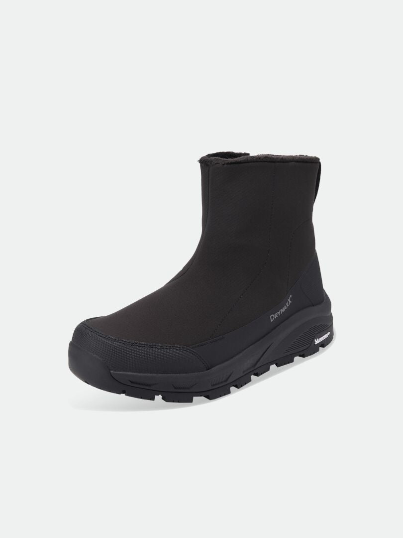 Vinterstövlar av modellen Black Kajuk Mid DX IC med en tjock, mönstrad sula och pälsfodrad krage.