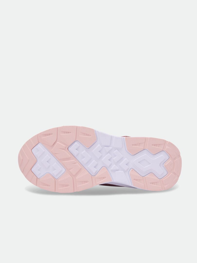 Yttersulan på Halti Zuma Mid DX Sneaker Junior i rosa och vitt, sedd underifrån mot en enfärgad bakgrund.