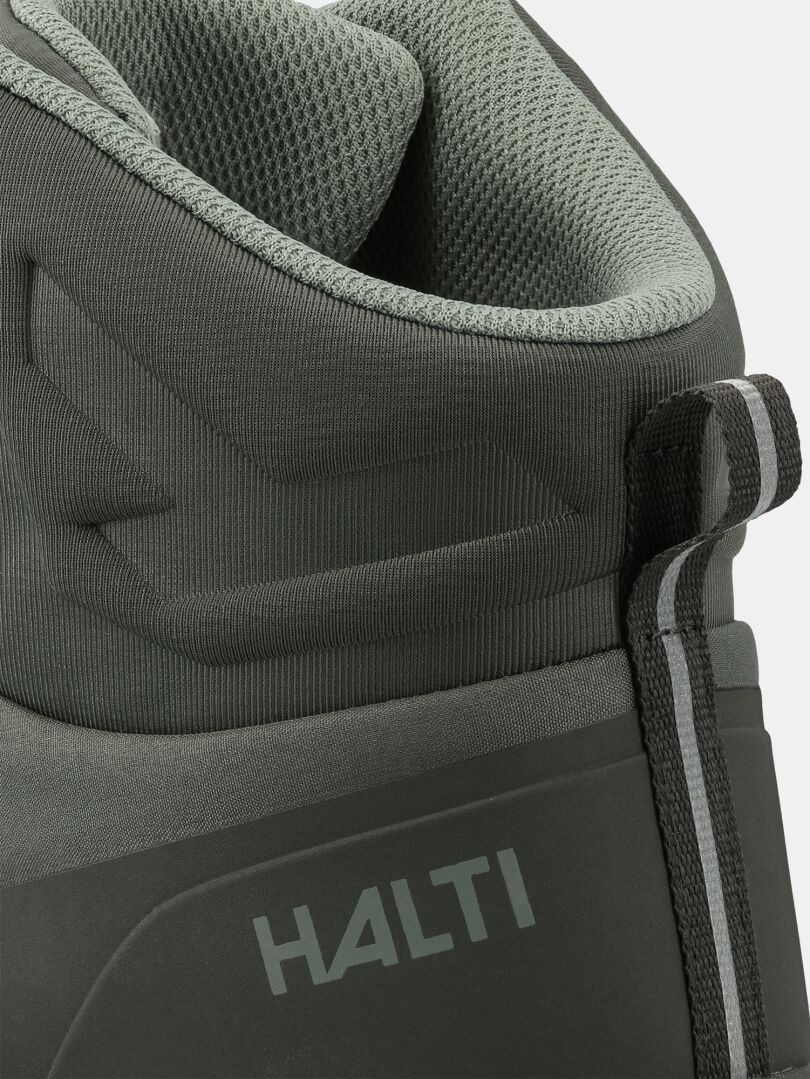 Närbild på Halti Fara 4 DX Mid Herr – grön, grå dragflik, designad för friluftsäventyr.