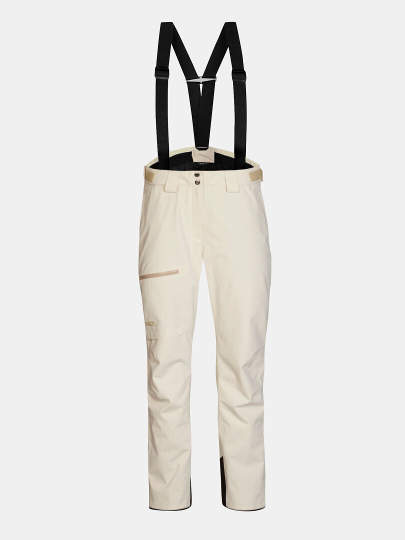Off-white Halti Carvey II DX skidbyxor för dam med justerbara svarta hängslen och en sidoficka med dragkedja.