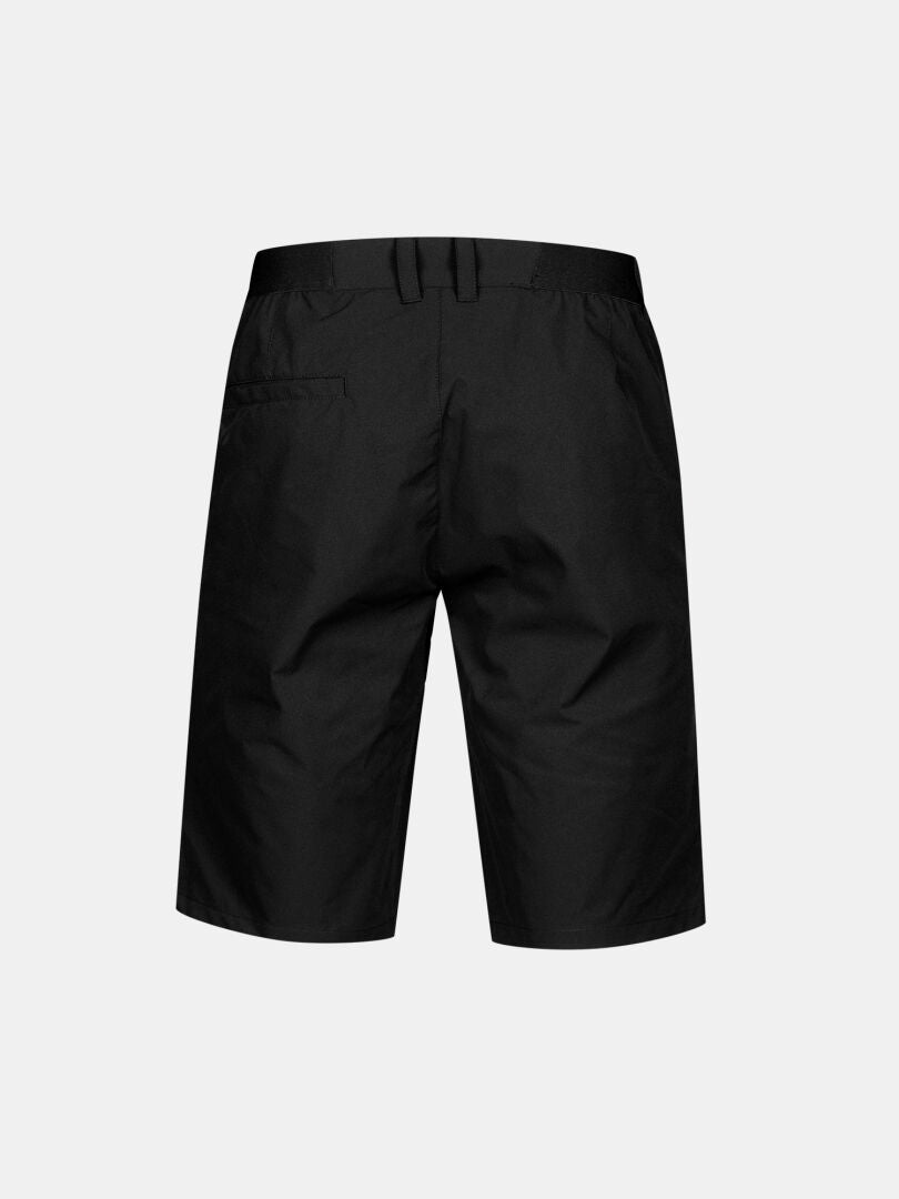 Halti Drive X-stretch Shorts Herr i svart, knälånga, visas bakifrån med bälteshällor och en höger bakficka.