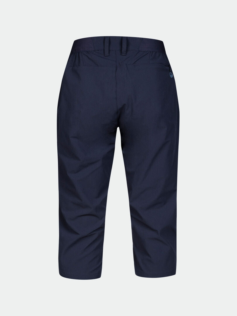 Halti Drive X-stretch Capribyxor Dam i marinblått, PFC-fritt, med bälteshällor och en höger bakficka med knapp.