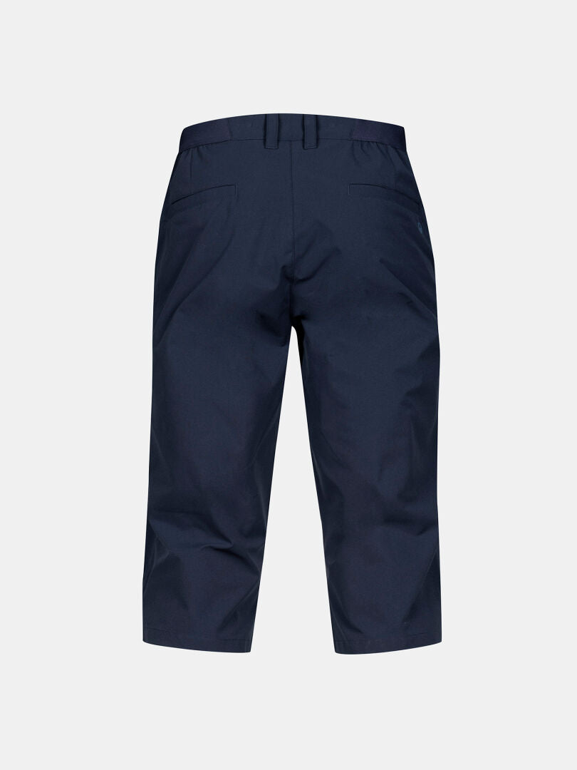 Halti Drive X-stretch Capribyxor Herr i marinblått med UPF 50+, bälteshällor och bakfickor sedda bakifrån.