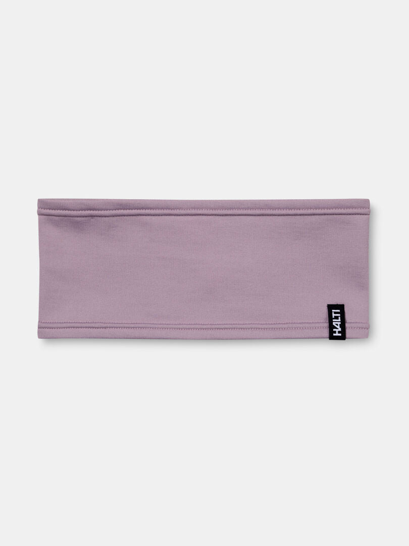 Halti Loiva Pannband är ett lavendelfärgat Active Dry Jersey-pannband med en liten svartvit tagg på kanten.