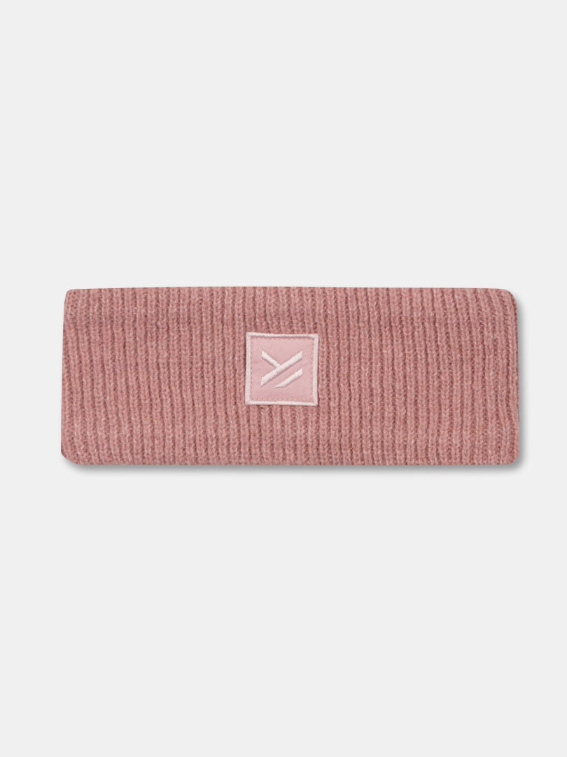 Halti Huurre Pannband är ett rosa ribbat pannband med en rektangulär patch och enkel design i frontlinjen.