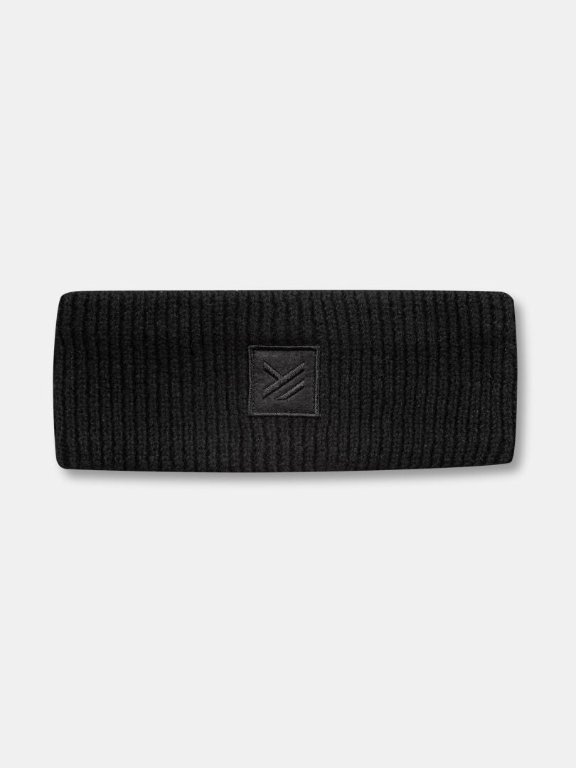 Halti Huurre Pannband är ett svart ribbat pannband med en fyrkantig patch i mitten på framsidan och präglad geometrisk design.