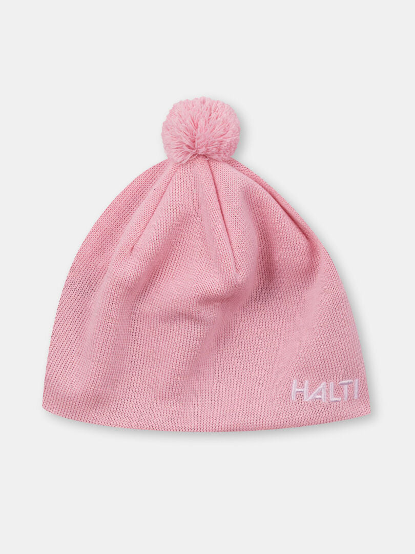 Halti Peesi II Mössa: ljusrosa merinoullhatt med pom-pom och vit broderad Halti-logotyp på brättet.