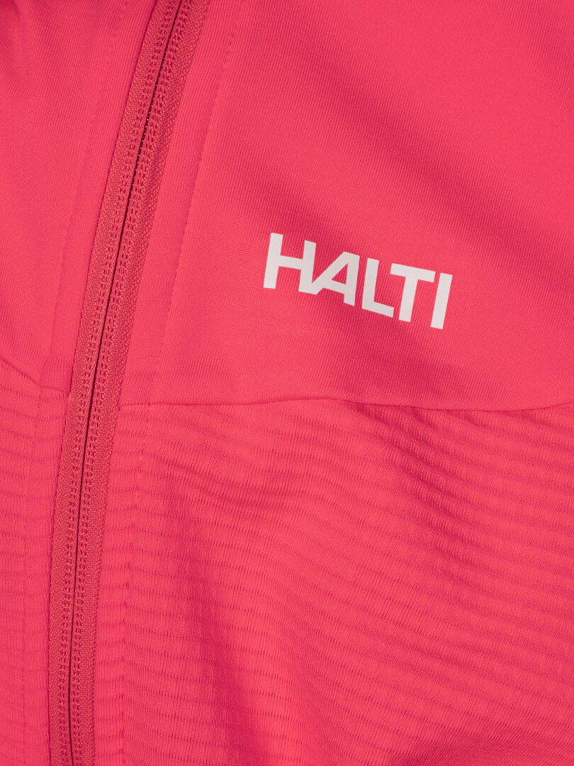 Närbild av en rosa Halti HeatGrid Mellanlager Dam-jacka med dragkedja och vit Halti-logotyp.